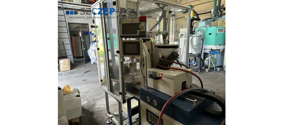 Wtryskarka  Cronoplast S.L. BabyPlast 6/10 Vp-T⌀12 / Linia produkcyjna z robotem, stołem obrotowym i dodatkową automatyzacją, 6,25 t, 2011 - zdjęcie