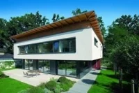 Dom jednorodzinny z oknami i drzwiami tarasowymi w systemach Schüco AWS, Schüco