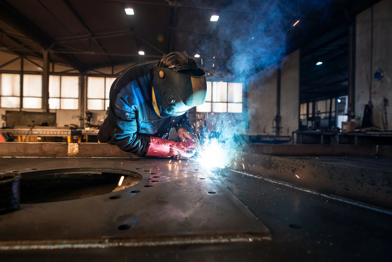 professional-industrial-welder-welding-metal-parts-metalworking-factory